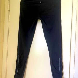Lululemon Black Leggings with Zipper Pocket in d back . Excellent condition